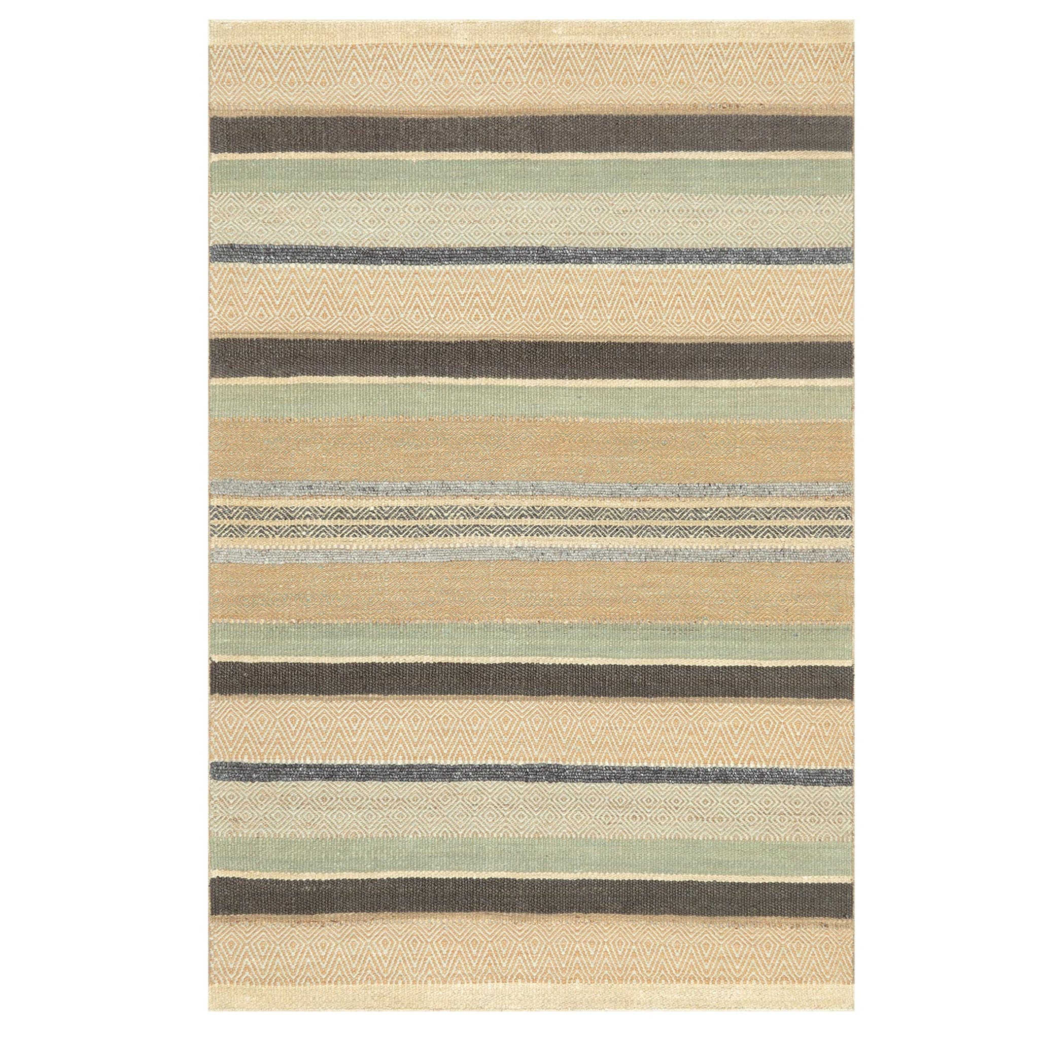 Celebrating the fact that Africa hosts the world’s largest hot desert, this rug was designed to evoke the rich colours and lines seen in desert sands.