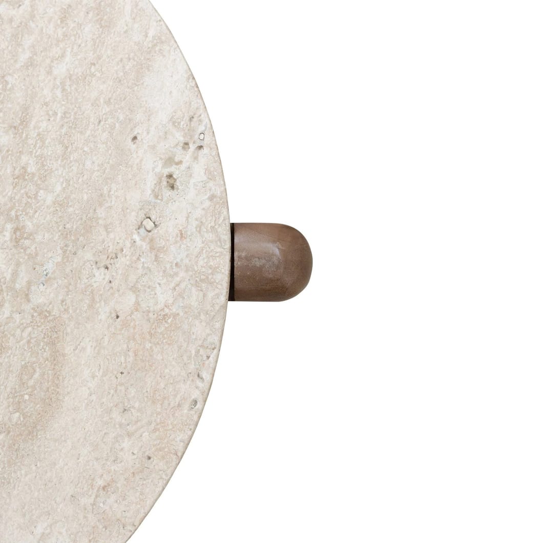 The Cascade side tables and coffee tables blends the warmth of wood with the cool sophistication of stone. Crafted by hand, these head-turners feature legs made of solid mango wood and a travertine tabletop, miming the classic appeal of marble with its polished finish.