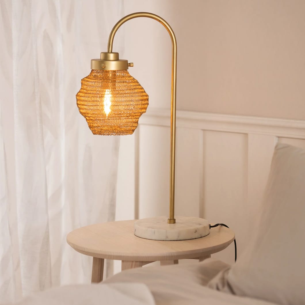Embrace organic beauty with our Rookery bedside lamp. This tactile design features malleable powder-coated steel mesh that can be shaped to suit your personal aesthetic. The lamp features a marble base and is available in three natural colourways, encouraging a tranquil mood in any living space.