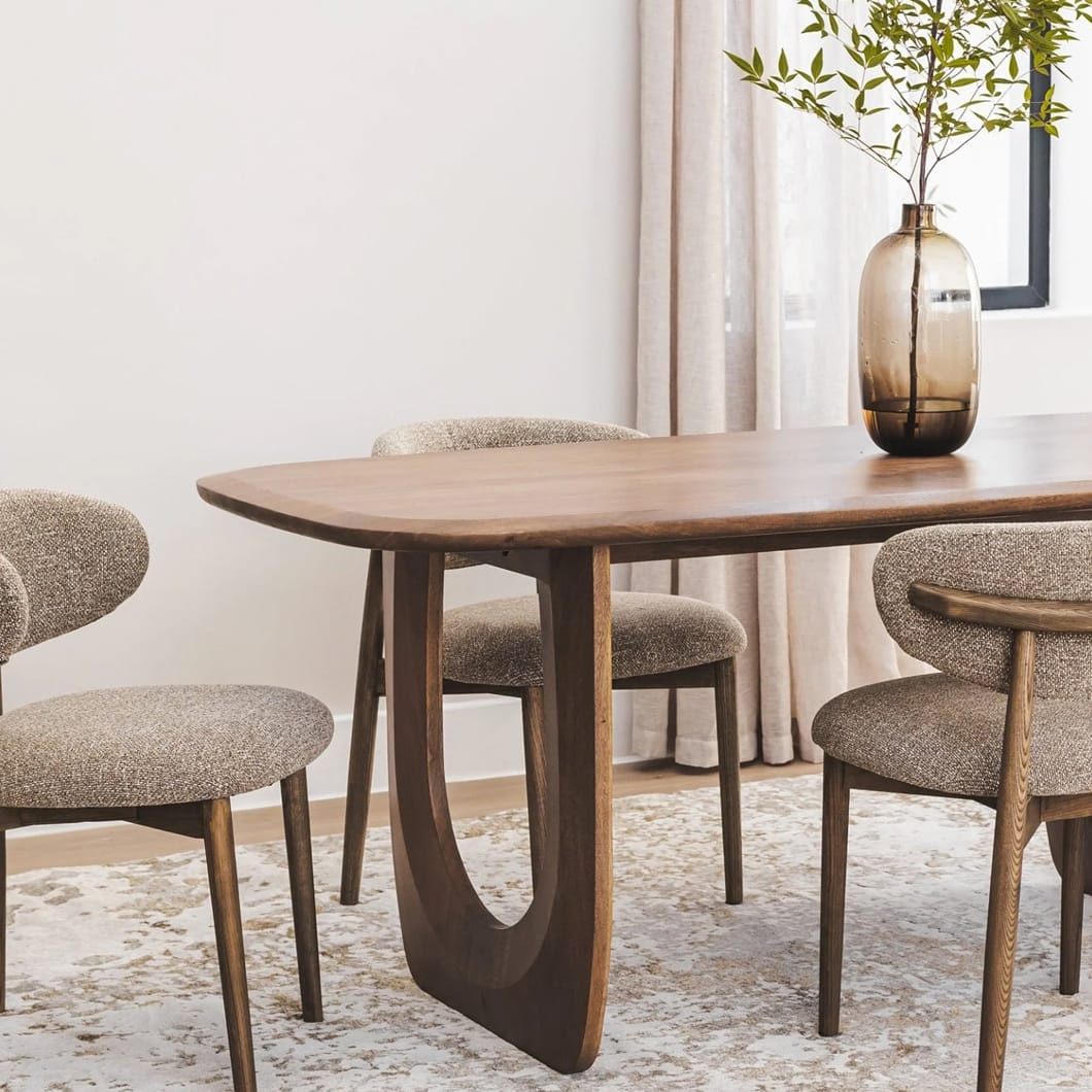 The dark and dashing Archer table exudes warmth and natural elegance. With a solid mango wood construction and smooth finish, it will provide a charming focal point for family gatherings or festive meals. Seats 10 - 12. Minor assembly required.