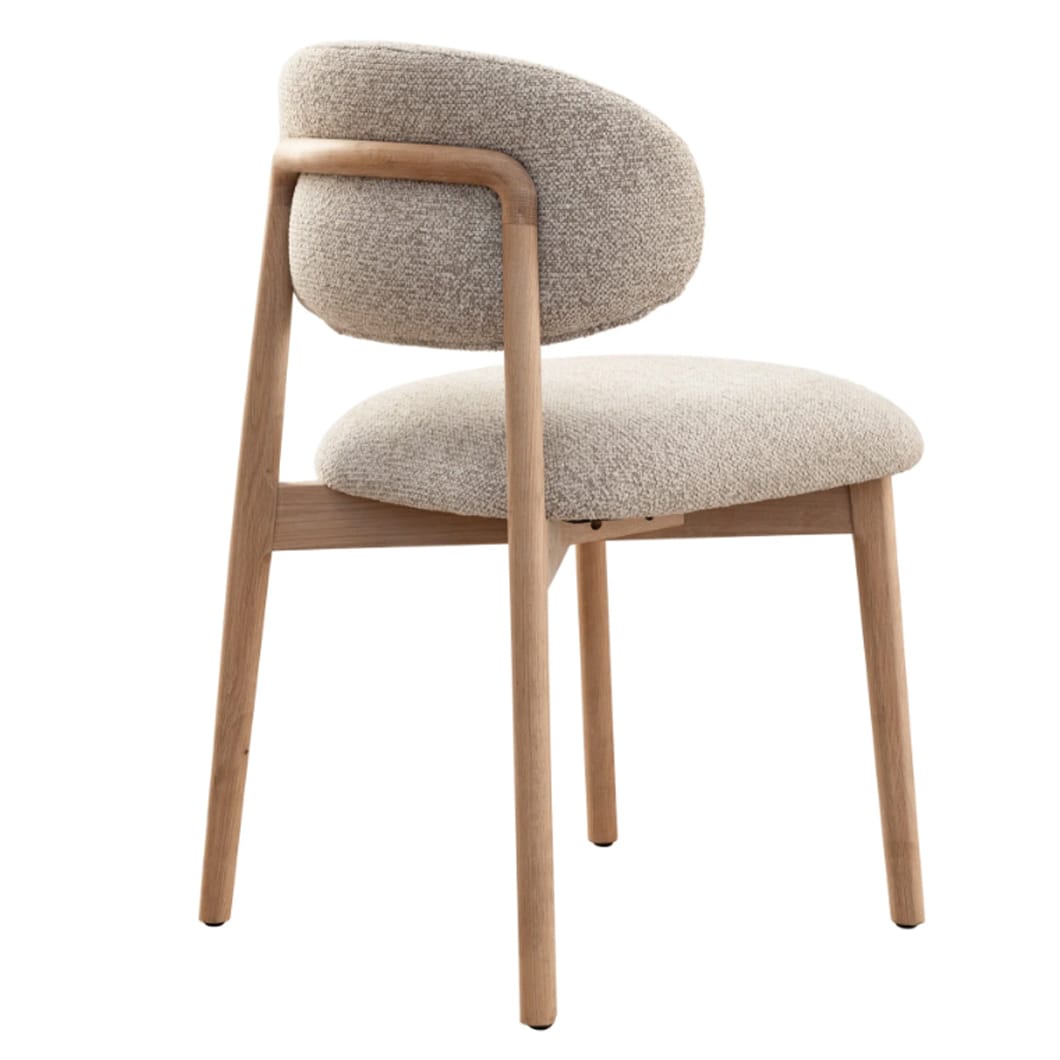 The clean, architectural lines of the Milano solid oak dining chair is a nod to modern design. Upholstered in luxurious 100% Polyester fabric and featuring a robust oak frame, this chair exudes both strength and sophistication. Whether placed at a dining table or in a reading nook, the Milano bridges the gap between contemporary and classic style. Ergonomically curved backrest. Available in two colourways.