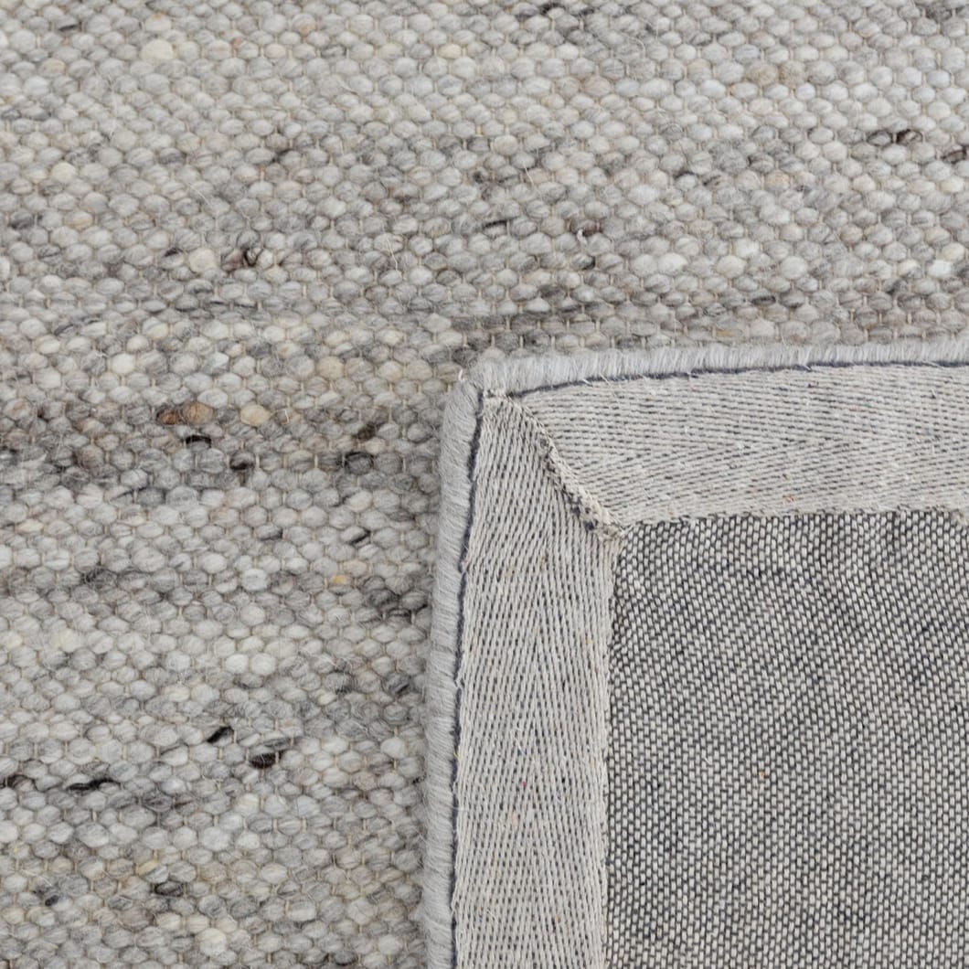 Embrace understated elegance with Harmonise rug, easy-to-style foundational pieces that blend functionality and comfort. Composed primarily of wool and featuring four neutral shades, these rugs will complement any decor scheme, while creating a warm and inviting atmosphere in your home. Handwoven in India for lasting quality and timeless elegance 90% Wool, 10% Cotton.