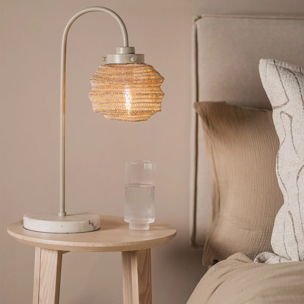 Embrace organic beauty with our Rookery bedside lamp. This tactile design features malleable powder-coated steel mesh that can be shaped to suit your personal aesthetic. The lamp features a marble base and is available in three natural colourways, encouraging a tranquil mood in any living space.
