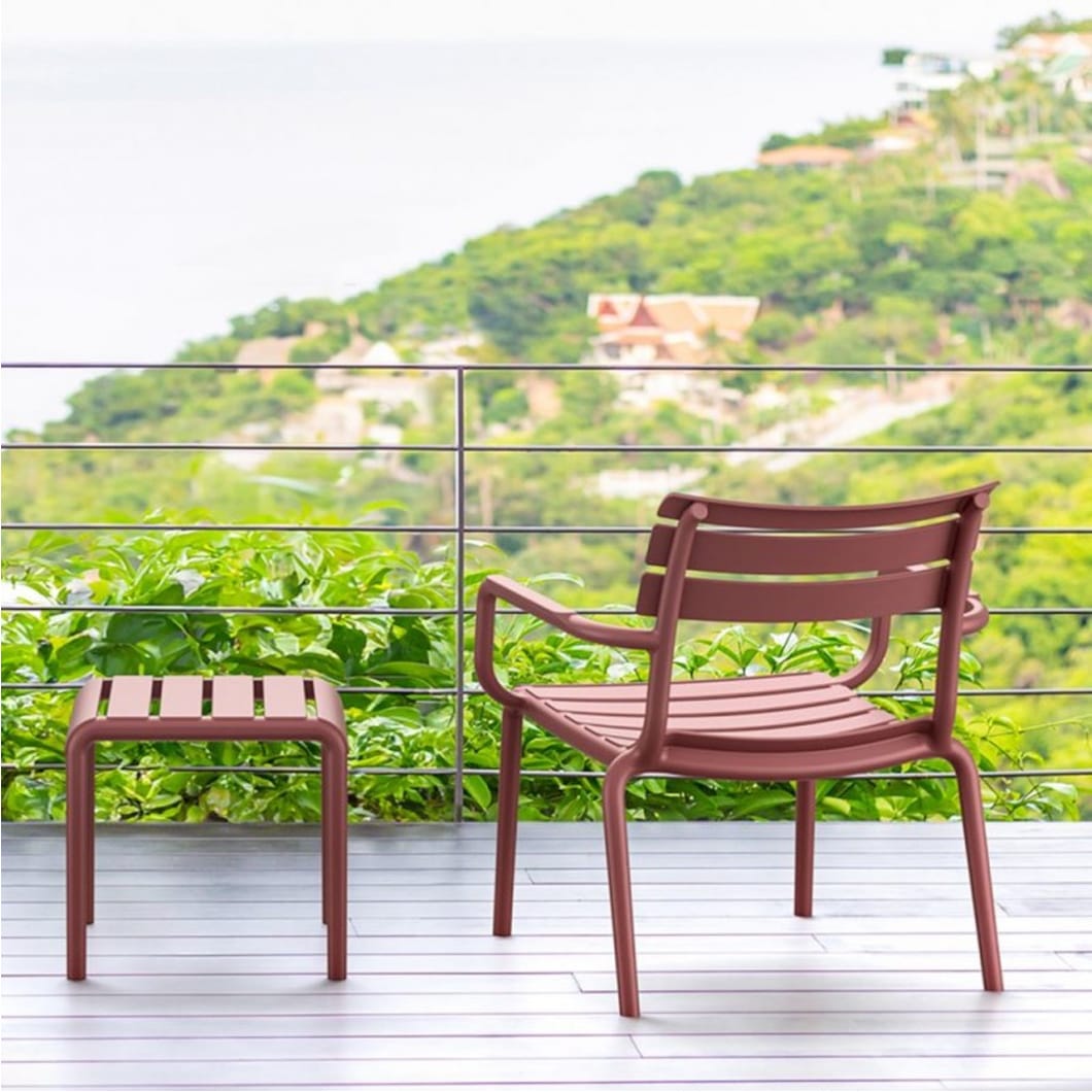 Paris Lounge Armchair is stackable and produced with a single injection of polypropylene reinforced with glass fiber, for indoor and outdoor use and with non-slip feet. Pair it with the matching footrest table, perfectly designed to echo the chair's stylish silhouette.