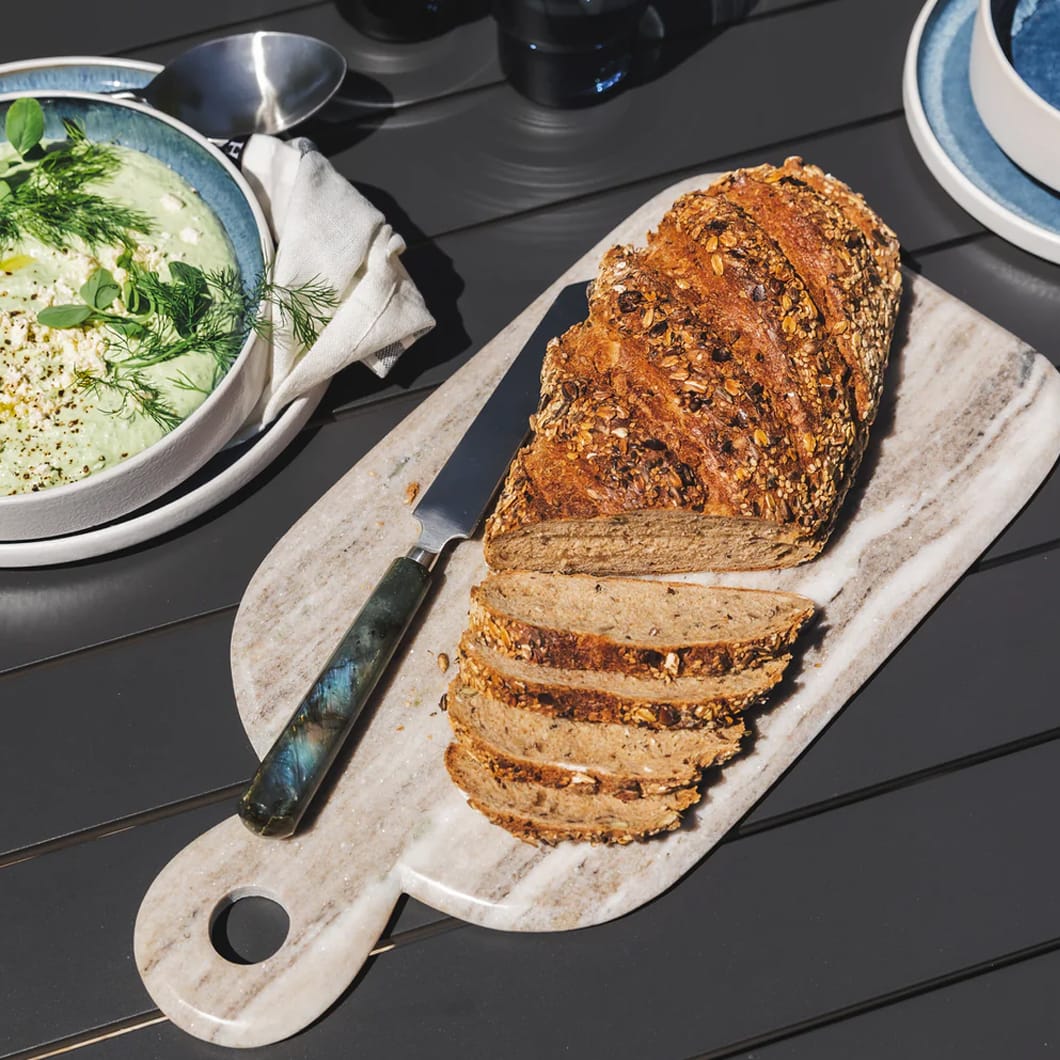 The Stonehaven cutting board will be a practical yet pleasing addition to your kitchen. Composed of sandstone, the weight of this handmade board gives it stability on countertops, preventing slipping during use. The Stonehaven is ideal not only for chopping tasks, but for food presentation too