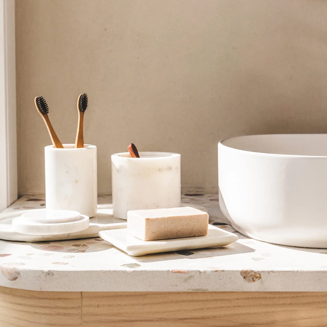 The Divine collection of bathroom accessories will bring a touch of serenity to your daily morning and evening rituals. Made of marble and featuring refreshing alabaster and olive tones, this heavenly range consists of a soap dish, tray, tumbler and a container that comes with a spoon (perfect for your precious bath salts).