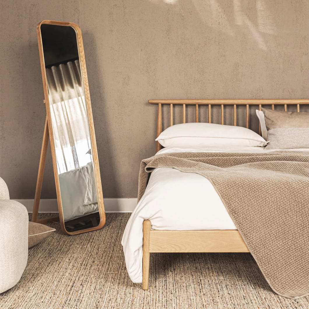 Crafted from sturdy solid oak and featuring exquisite curved frames with a smooth finish, Stately Reflection mirrors merge natural elegance with modern design. The range comprises six styles, including a floor mirror with a stand and variously shaped wall-mounted mirrors, all of which impart a touch of organic beauty. Choose between two shades, a natural oak tone or a darker brown. The mirrors come with secure hanging hardware.