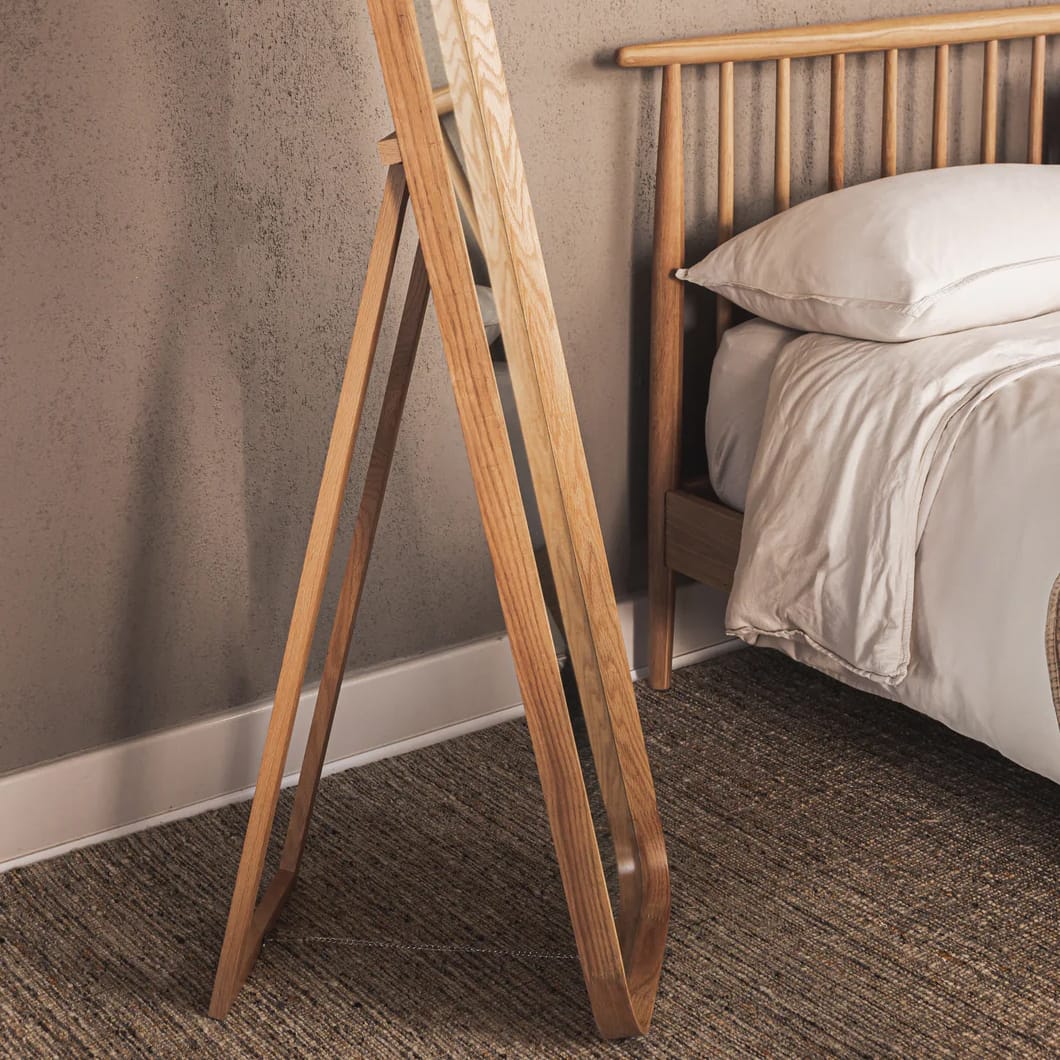 Crafted from sturdy solid oak and featuring exquisite curved frames with a smooth finish, Stately Reflection mirrors merge natural elegance with modern design. The range comprises six styles, including a floor mirror with a stand and variously shaped wall-mounted mirrors, all of which impart a touch of organic beauty. Choose between two shades, a natural oak tone or a darker brown. The mirrors come with secure hanging hardware.